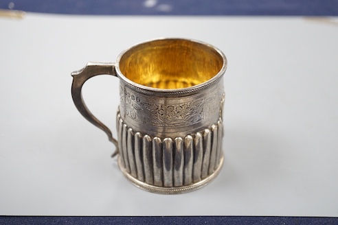 A George IV demi-fluted silver christening mug, with later engraved inscription, London, 1823, 69mm.